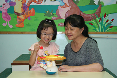 Callie receives hearing and language training at Suen Mei Speech & Hearing Centre.